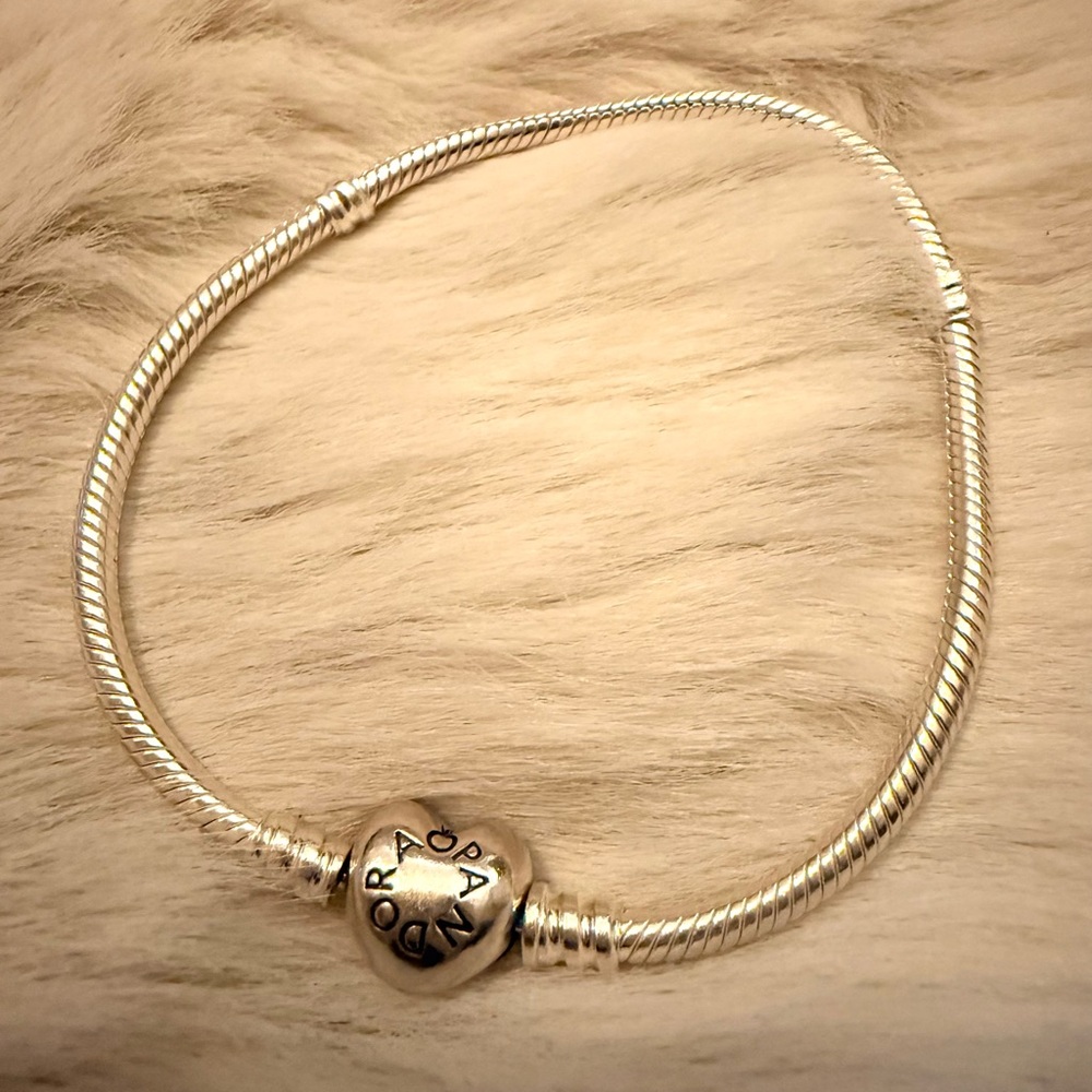 Never worn Pandora Sterling Silver Moments Charm Bracelet with heart clasp.